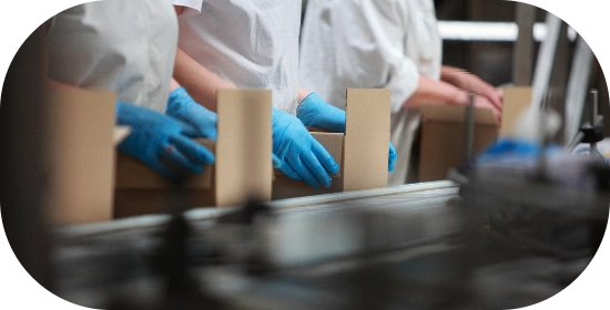 People’s hands working on kit assembly